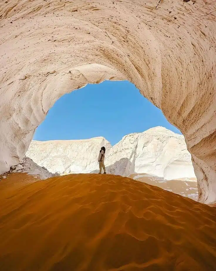 Travelers exploring Egypt's White Desert with a local guide